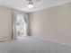 Bedroom featuring carpeted floors, a ceiling fan, and access to a balcony at 5603 S Pagosa Ct, Centennial, CO 80015