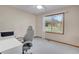 Serene bedroom featuring a large window offering views of the backyard landscape at 5603 S Pagosa Ct, Centennial, CO 80015