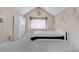 Cozy bedroom features a modern bed frame, a decorative window nook, and ample closet space at 5603 S Pagosa Ct, Centennial, CO 80015