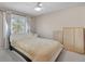 Bedroom showcasing a bed with a white headboard, a window and curtains at 5603 S Pagosa Ct, Centennial, CO 80015