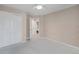Bedroom with neutral colored walls, carpeted floors, and a large closet at 5603 S Pagosa Ct, Centennial, CO 80015