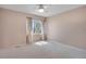 Bedroom featuring carpeted floors, a window and neutral colored walls at 5603 S Pagosa Ct, Centennial, CO 80015