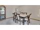 Elegant dining room featuring a large marble table, seating for six, and sophisticated furnishings at 5603 S Pagosa Ct, Centennial, CO 80015