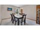 Formal dining room featuring a large marble table, seating for six, and elegant decor at 5603 S Pagosa Ct, Centennial, CO 80015