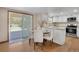 Eat-in kitchen featuring stainless appliances, granite countertops, and backyard access at 5603 S Pagosa Ct, Centennial, CO 80015