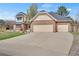 Charming two-story home with a three-car garage and large driveway providing ample parking space at 5603 S Pagosa Ct, Centennial, CO 80015