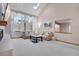 Well-lit living room offering comfortable seating and large windows for natural light at 5603 S Pagosa Ct, Centennial, CO 80015