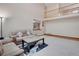 Open-concept living area with a view of the second-story railing and adjacent spaces at 5603 S Pagosa Ct, Centennial, CO 80015