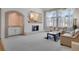 Spacious living room with a fireplace and access to a stylish wet bar area at 5603 S Pagosa Ct, Centennial, CO 80015