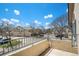 Balcony view of the townhome community under a bright blue sky at 8777 E Dry Creek Rd # 1426, Englewood, CO 80112