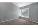 Bright bedroom featuring neutral-toned walls, carpet flooring and a window seat at 8777 E Dry Creek Rd # 1426, Englewood, CO 80112