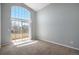 Bright, large bedroom with sliding glass doors to balcony with a large window that let in natural light at 8777 E Dry Creek Rd # 1426, Englewood, CO 80112