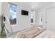 Bright bedroom featuring large windows, sleek decor, and neutral colors at 1232 N Yates St # 3, Denver, CO 80204