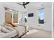 Sun-lit bedroom with large windows, ceiling fan, and sleek decor at 1232 N Yates St # 3, Denver, CO 80204