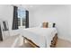 Bright bedroom featuring a large window with blackout curtains and neutral decor at 1232 N Yates St # 3, Denver, CO 80204