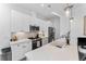 Modern kitchen featuring white cabinets, stainless steel appliances, and ample counter space at 1232 N Yates St # 3, Denver, CO 80204