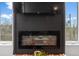 Cozy living room with sleek fireplace and mounted TV for relaxing entertainment at 1232 N Yates St # 3, Denver, CO 80204