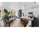Bright, open-concept living space featuring a modern kitchen, a comfortable living room, and large windows at 1232 N Yates St # 3, Denver, CO 80204