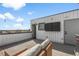 View of a comfortable outdoor patio with lounge furniture and string lights, ideal for relaxing or entertaining at 1232 N Yates St # 3, Denver, CO 80204