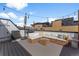 Outdoor rooftop deck with modern patio furniture and string lights at 1232 N Yates St # 3, Denver, CO 80204