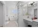 This bathroom features a modern glass shower, soaking tub, stylish vanity and a sleek design at 128 Chapel Hill Cir, Brighton, CO 80601