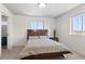 Bedroom with neutral carpet, and an abundance of natural light from a large window at 128 Chapel Hill Cir, Brighton, CO 80601