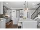 Modern kitchen featuring quartz countertops, stainless appliances, and an open layout at 128 Chapel Hill Cir, Brighton, CO 80601