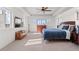 Spacious main bedroom with trey ceilings and an abundance of natural light from many windows at 128 Chapel Hill Cir, Brighton, CO 80601