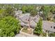 Aerial view of house showcasing roof, mature trees, adjacent tennis court, and driveway at 18171 E Arizona Ave # B, Aurora, CO 80017