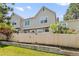 Backyard view with a wood fence and green grass and shrubbery at 18171 E Arizona Ave # B, Aurora, CO 80017