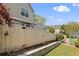 View of a backyard with a wood fence and some rocks and greenery at 18171 E Arizona Ave # B, Aurora, CO 80017
