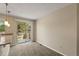 A dining area features a sliding glass door to the outside and carpeted floors at 18171 E Arizona Ave # B, Aurora, CO 80017