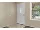 The entryway has neutral walls and tile floors near the front door and window at 18171 E Arizona Ave # B, Aurora, CO 80017