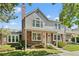 Inviting two-story townhome with brick accents, showcasing a well-maintained lawn and welcoming entrance at 18171 E Arizona Ave # B, Aurora, CO 80017