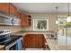 This open kitchen features granite countertops, stainless appliances, and plenty of natural light at 18171 E Arizona Ave # B, Aurora, CO 80017
