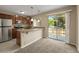 The kitchen includes granite countertops, stainless appliances, and bar-style seating at 18171 E Arizona Ave # B, Aurora, CO 80017