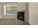 Cozy living room with carpet, natural light, and a fireplace with a granite hearth at 18171 E Arizona Ave # B, Aurora, CO 80017