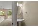 This powder room includes a pedestal sink and an oval mirror at 18171 E Arizona Ave # B, Aurora, CO 80017