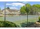 View of fenced-in tennis courts on the property at 18171 E Arizona Ave # B, Aurora, CO 80017