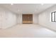 Finished basement featuring a built-in media cabinet and wood feature wall at 3120 Braun Ct, Golden, CO 80401