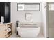 Spa-like bathroom featuring a freestanding tub and a frameless shower at 3120 Braun Ct, Golden, CO 80401