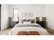 Bright bedroom featuring a comfortable bed and stylish nightstands at 3120 Braun Ct, Golden, CO 80401