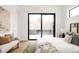 Bright bedroom with sliding glass doors opening to a deck at 3120 Braun Ct, Golden, CO 80401