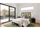 Serene bedroom with sliding glass doors leading to a private balcony at 3120 Braun Ct, Golden, CO 80401