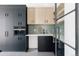 Well-appointed butler's pantry with green tile backsplash and ample storage at 3120 Braun Ct, Golden, CO 80401