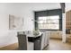 Bright dining room with a large table and grey upholstered chairs at 3120 Braun Ct, Golden, CO 80401