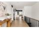 Bright hallway with light oak floors and views into the kitchen at 3120 Braun Ct, Golden, CO 80401