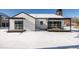 Back of house showing white siding, deck, and snowy yard at 3120 Braun Ct, Golden, CO 80401