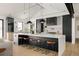 Modern kitchen with large island and breakfast bar, dark cabinetry at 3120 Braun Ct, Golden, CO 80401
