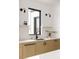 Sleek kitchen with white cabinets, quartz countertops, and a farmhouse sink at 3120 Braun Ct, Golden, CO 80401